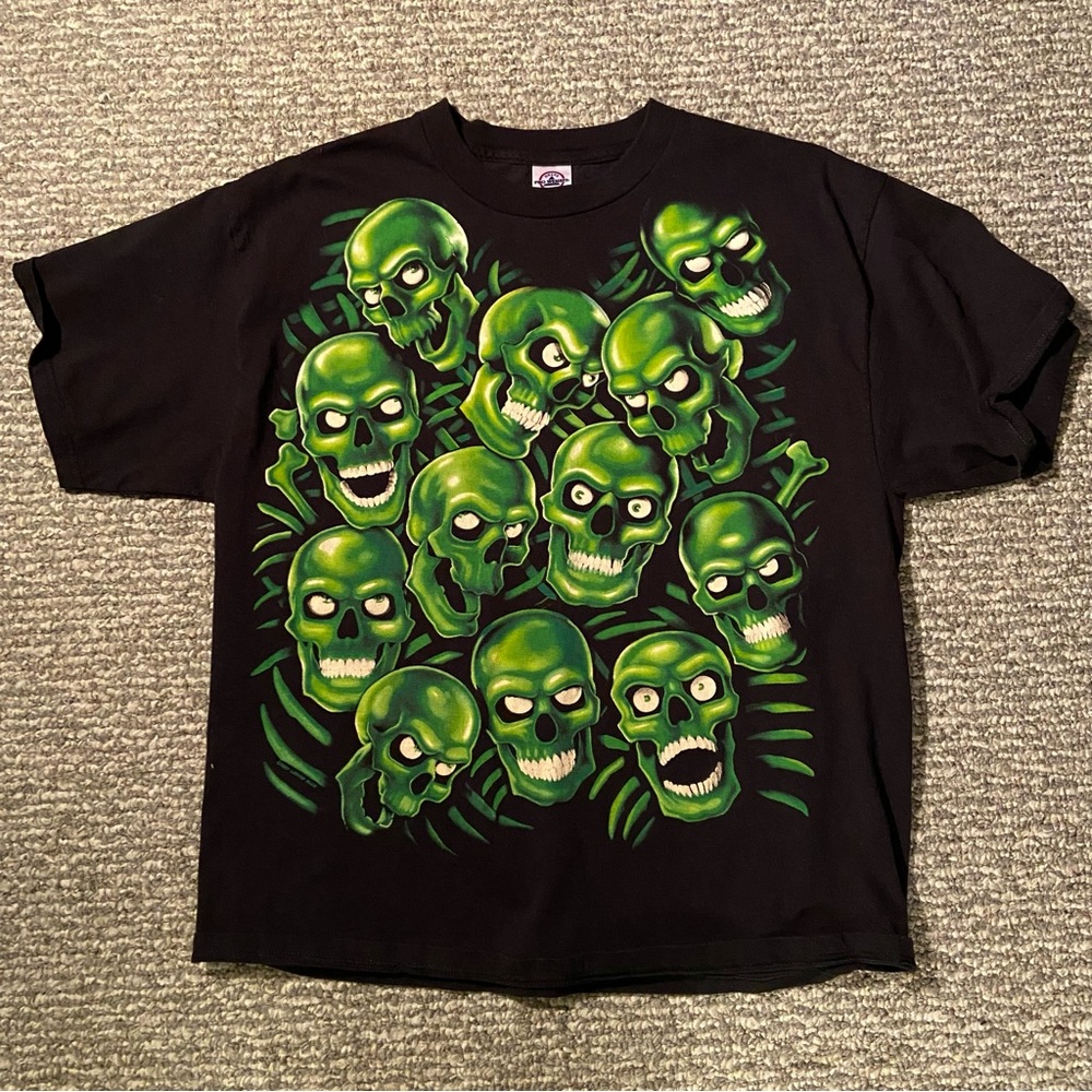 Liquid Blue pile of skulls shirt 🦠